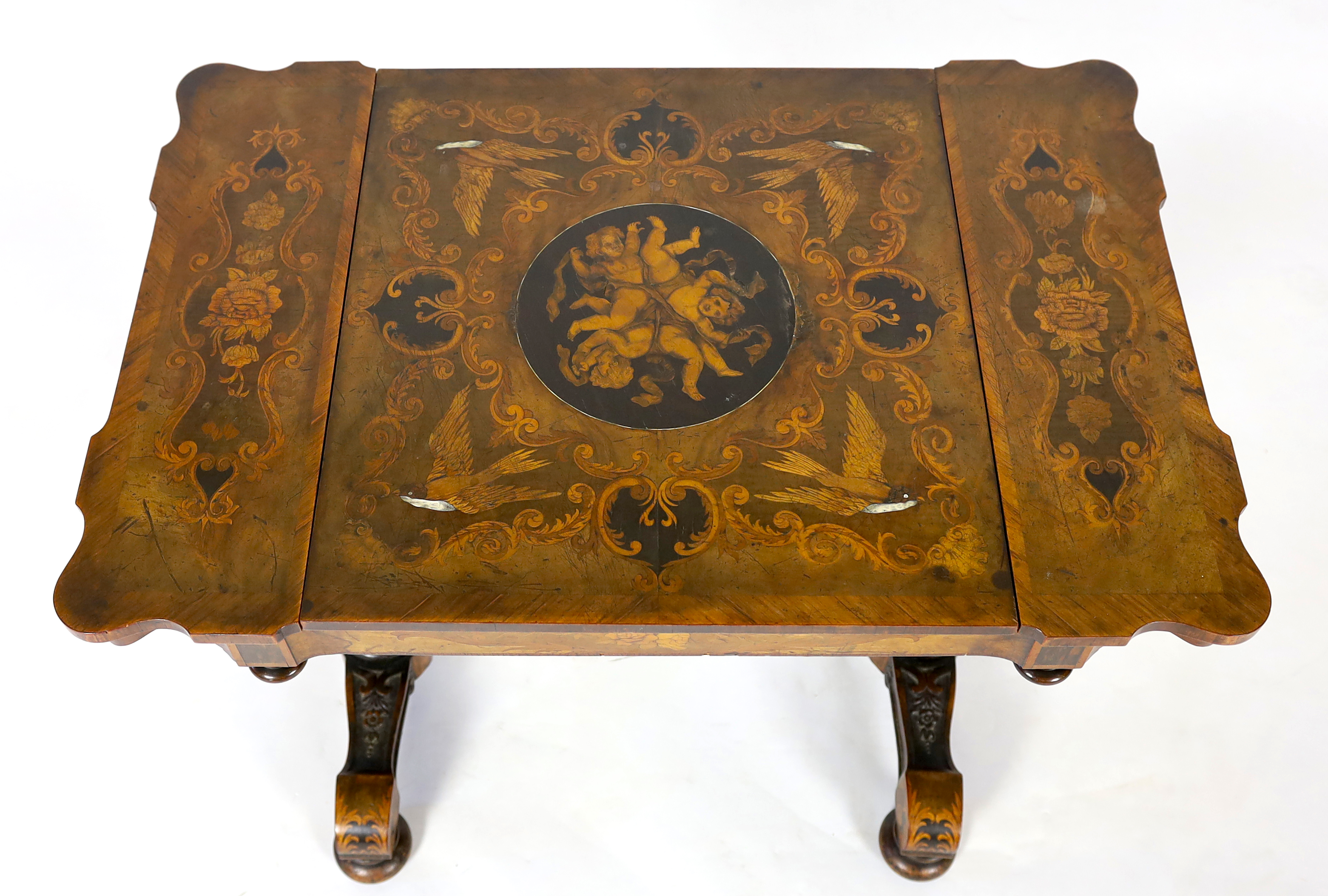 A 19th century French floral marquetry and tulipwood banded games table, 89cm wide, 58cm deep, 72cm high, Please note this lot attracts an additional import tax of 5% on the hammer price